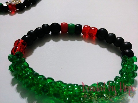 King & Queen "Red, black, green" wrist bracelet.
